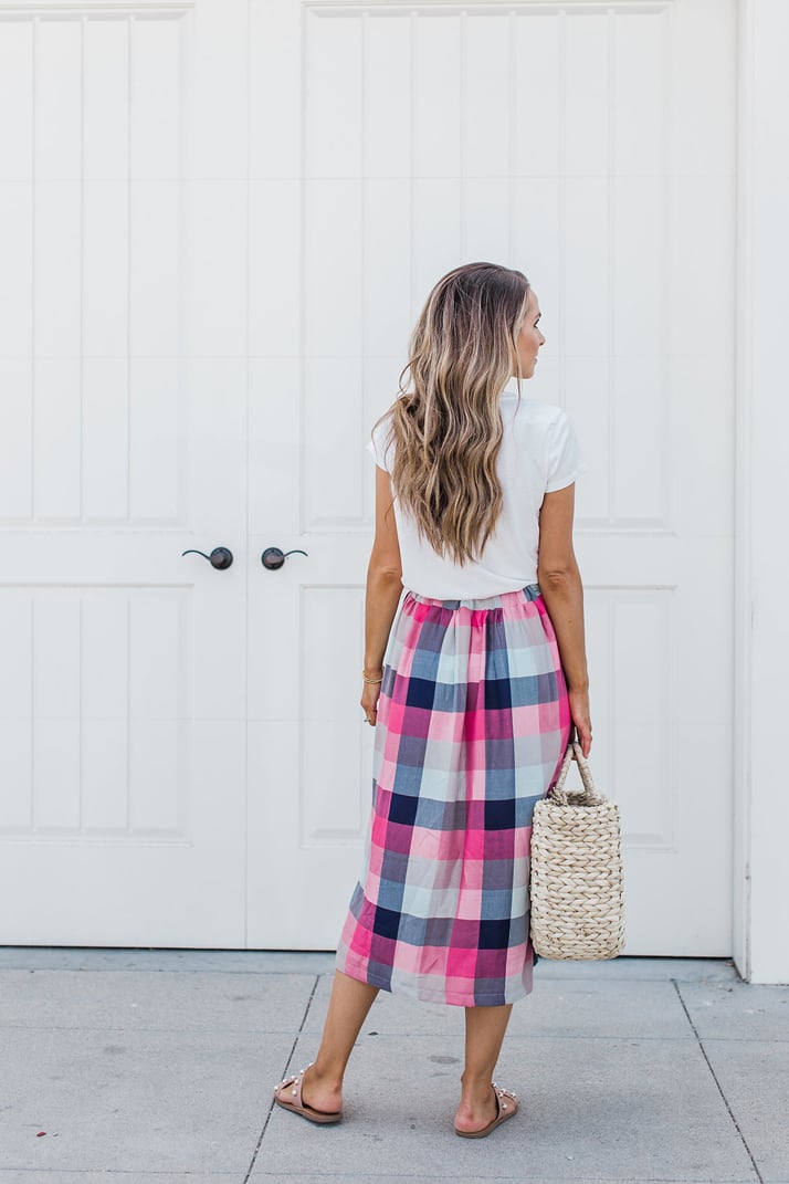 a plain white tee with a midi skirt