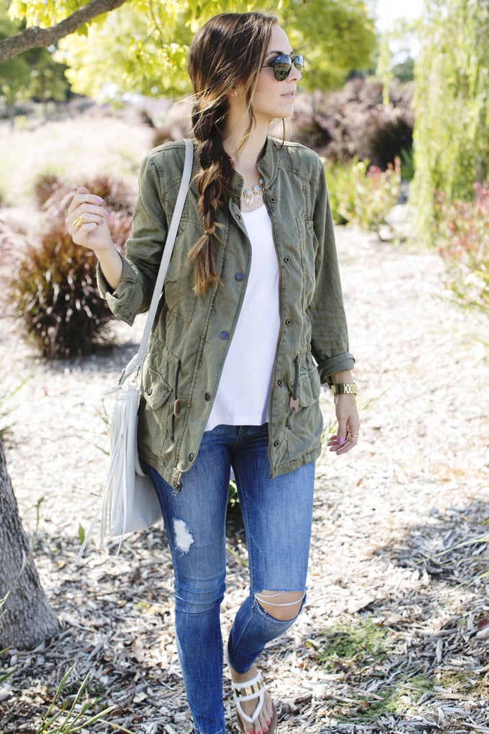 white tee with olive jacket and jeans
