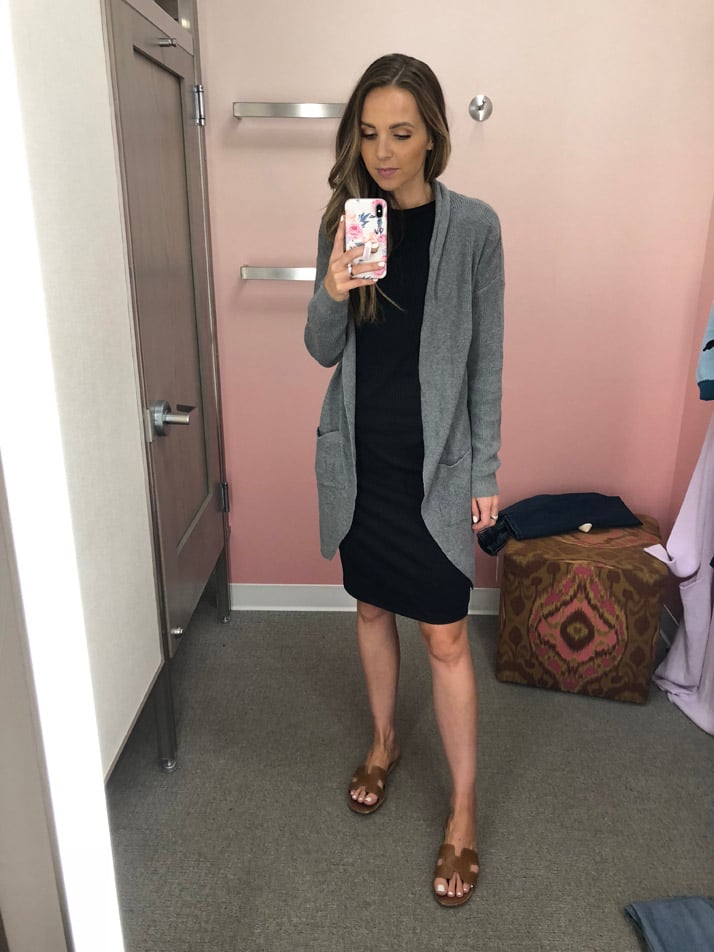 add a long sweater over a bodycon dress to dress it down