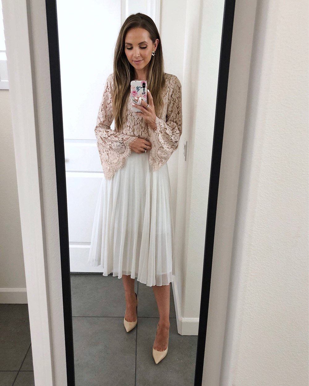blush lace top and white pleated skirt