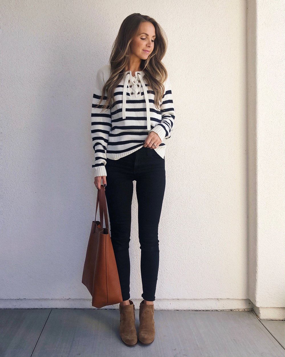 striped sweatshirt and black jeans
