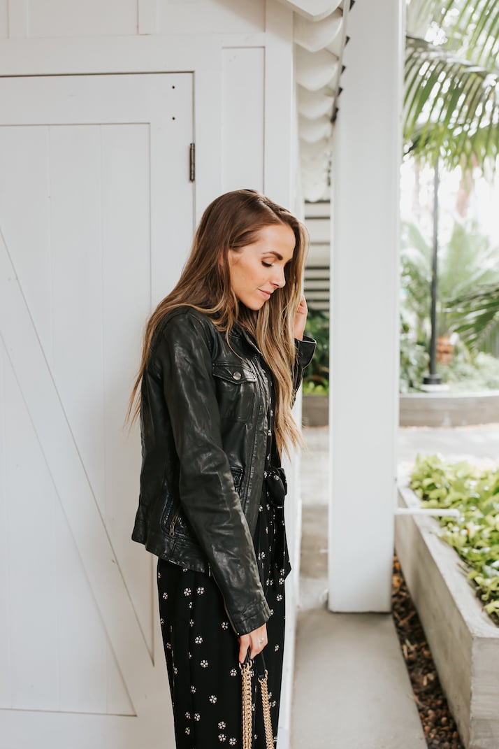 black leather jacket and black jumpsuit