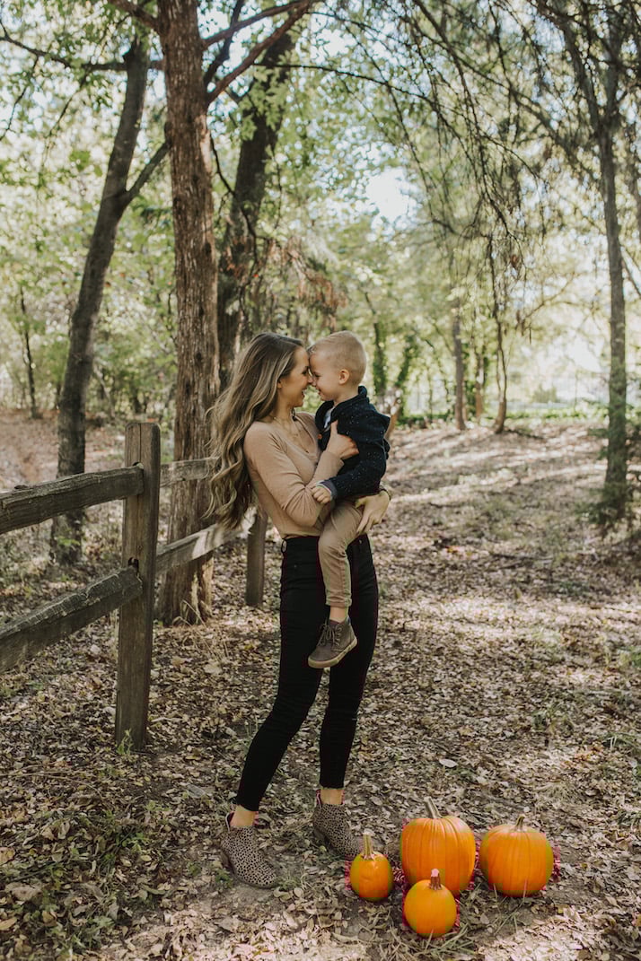 mom and boy spinning outside