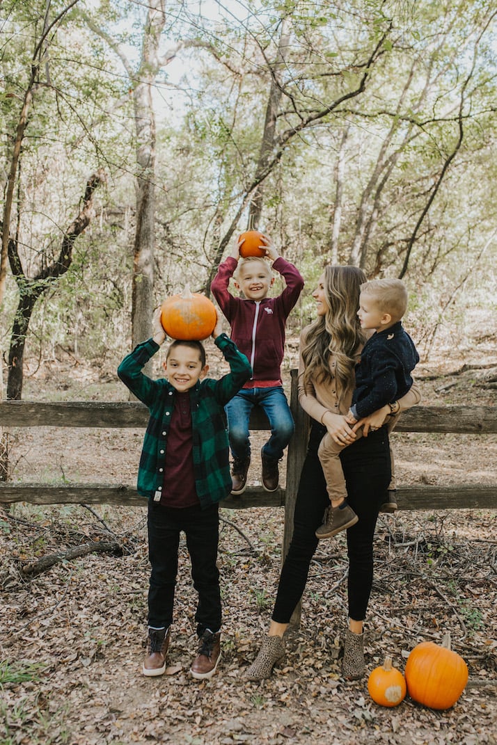mom and boys with pumpkins on their heads