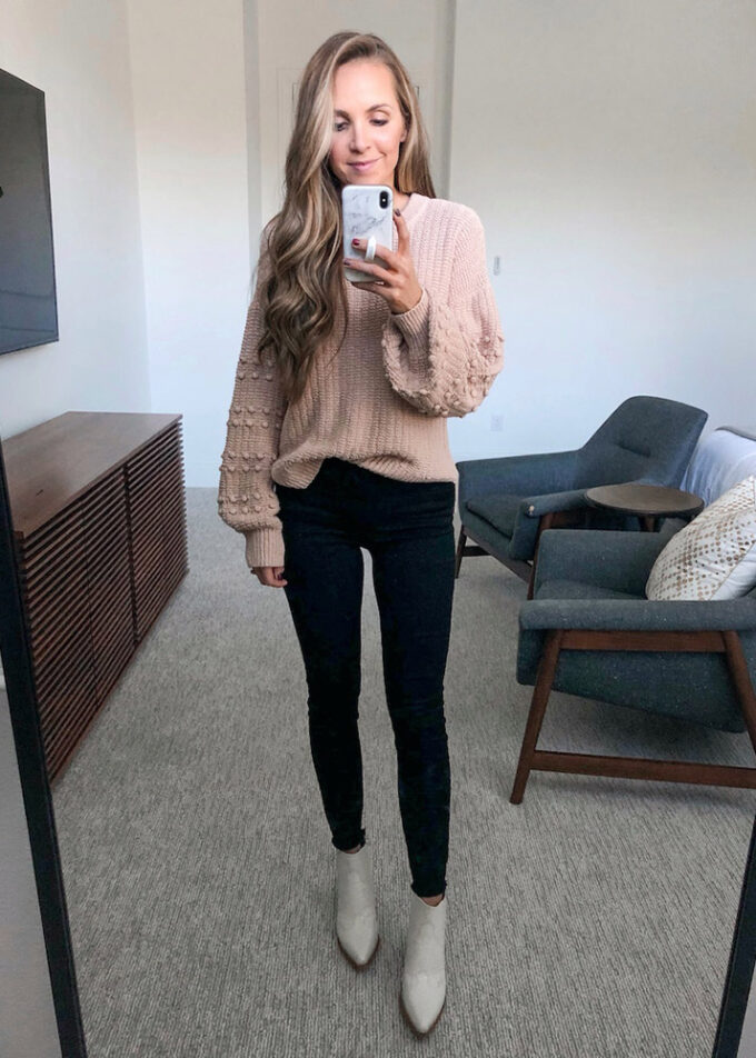 black jeans, puffed sleeve sweater, white boots