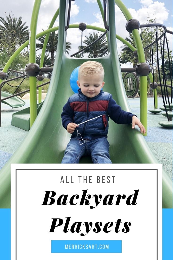 boy at the park sliding down the slide