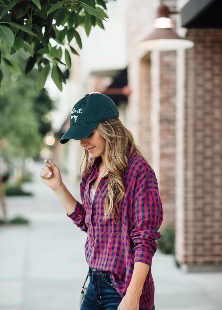 baseball hat and plaid top