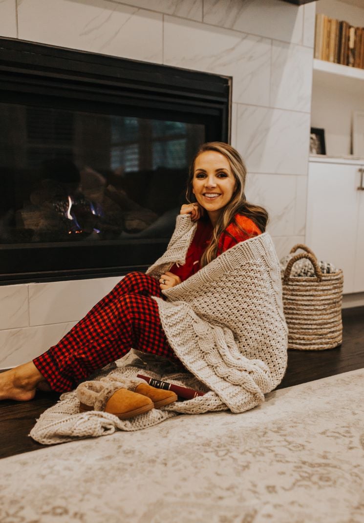 merrick wrapped in a blanket by the fire with rack room shoes slippers