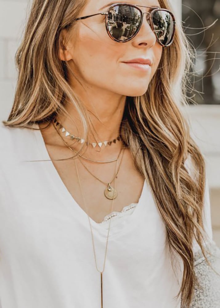 layered necklace and sunglasses