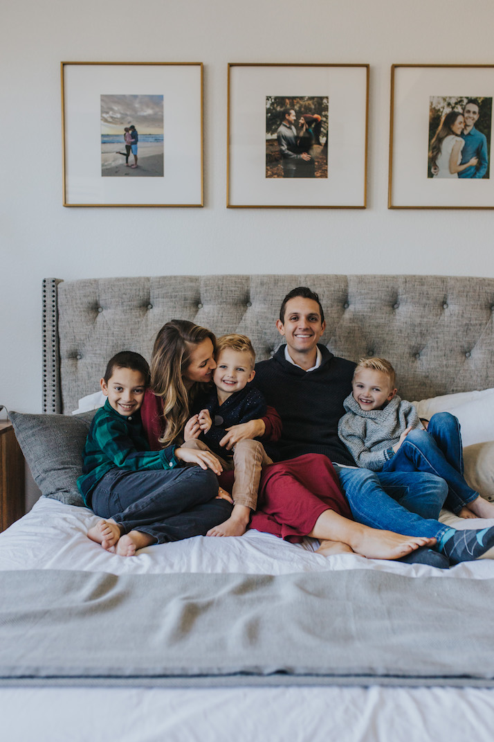 family of five on gray bed