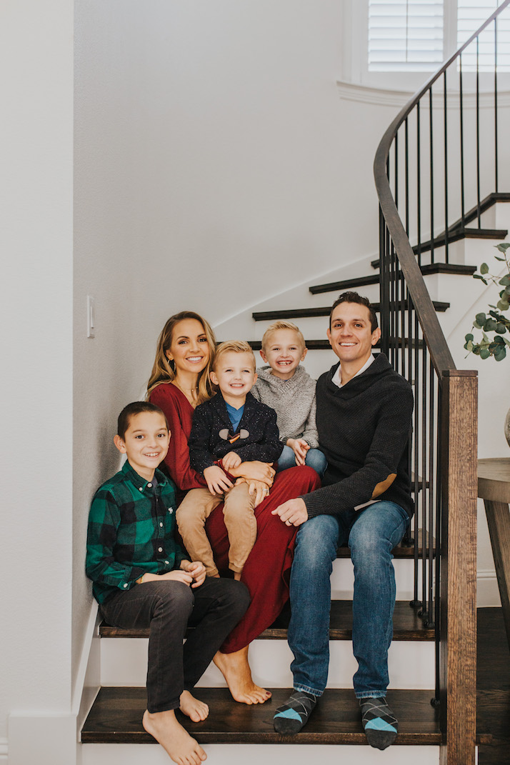 family sitting on curved staircase