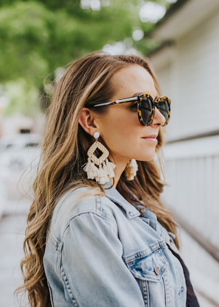 denim jacket and statement earrings