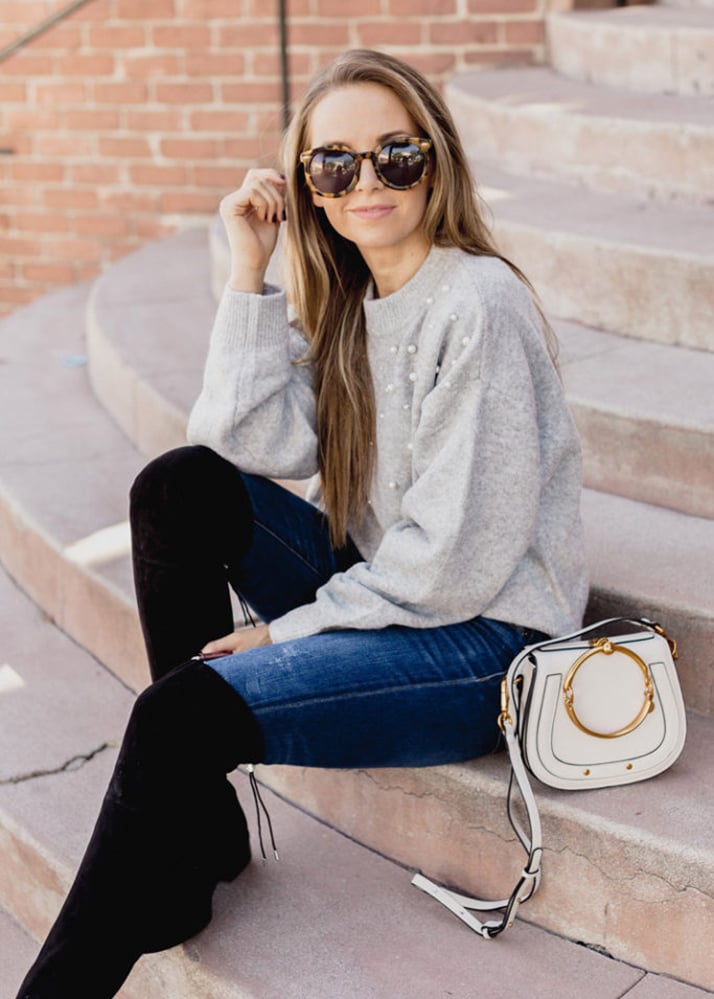 tortoiseshell sunglasses and gray sweater