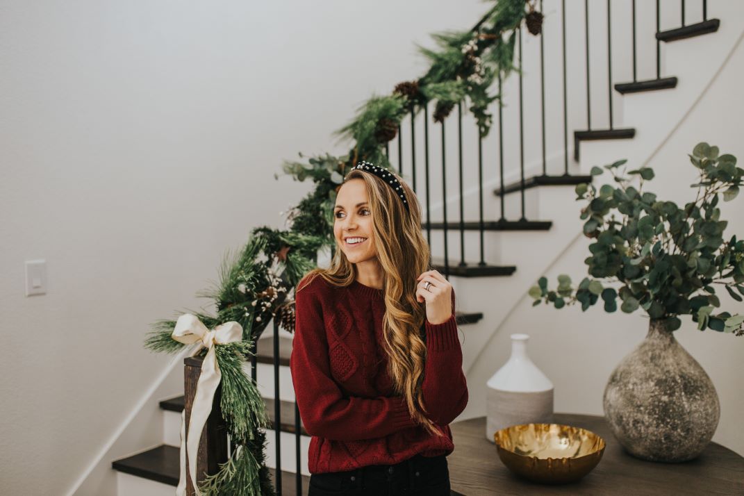 cable knit sweater with curved staircase with garland