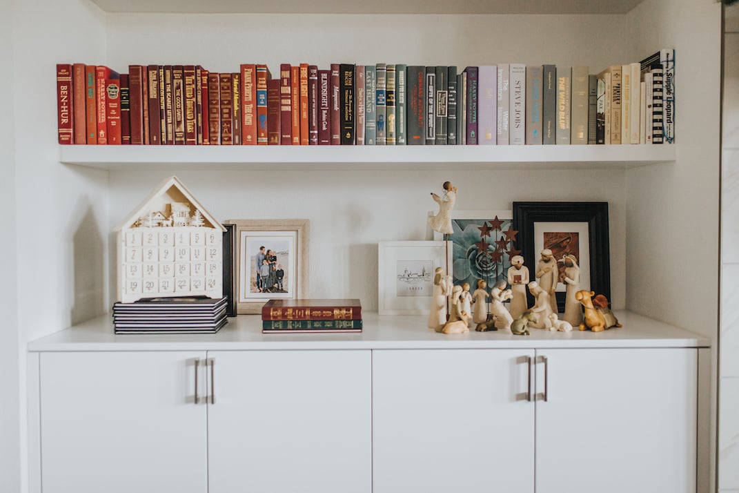 rainbow bookshelf with christmas decorations