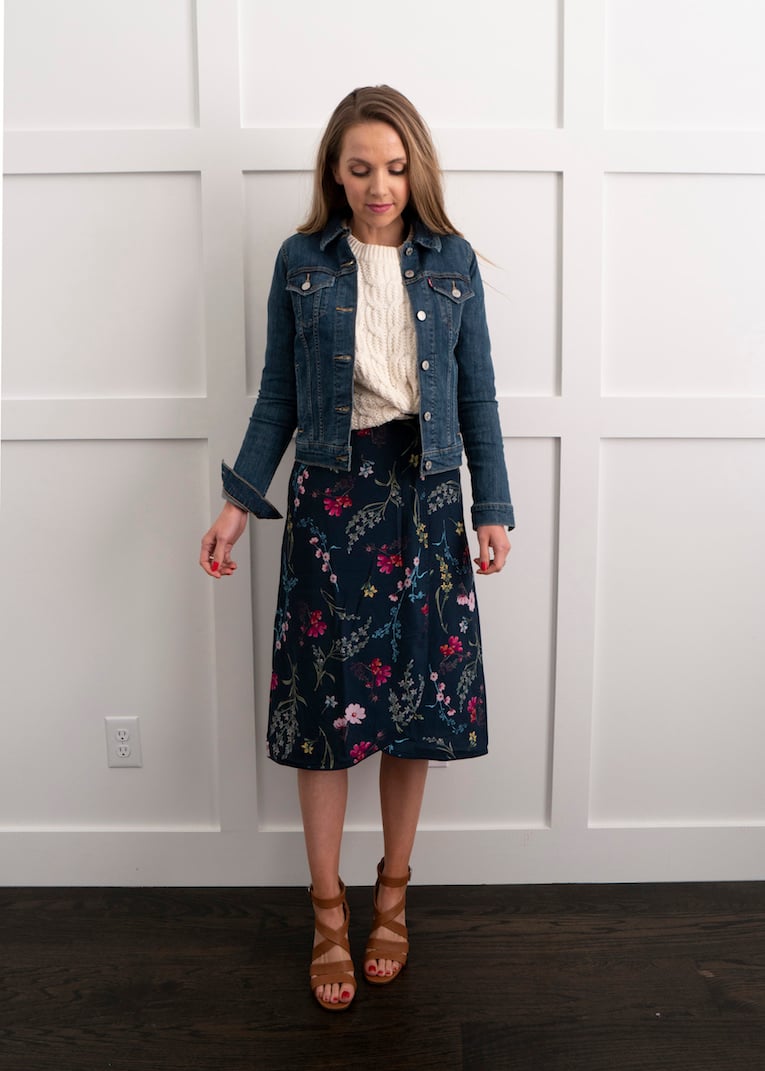 cable knit sweater with floral dress and denim jacket