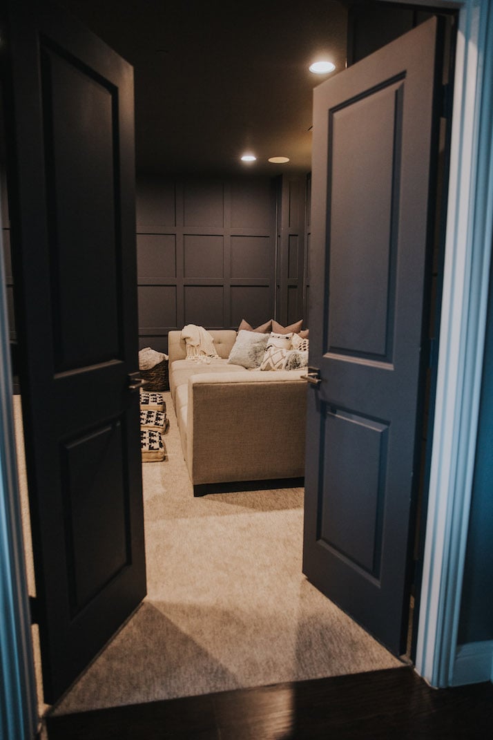 home theater room with wall paneling