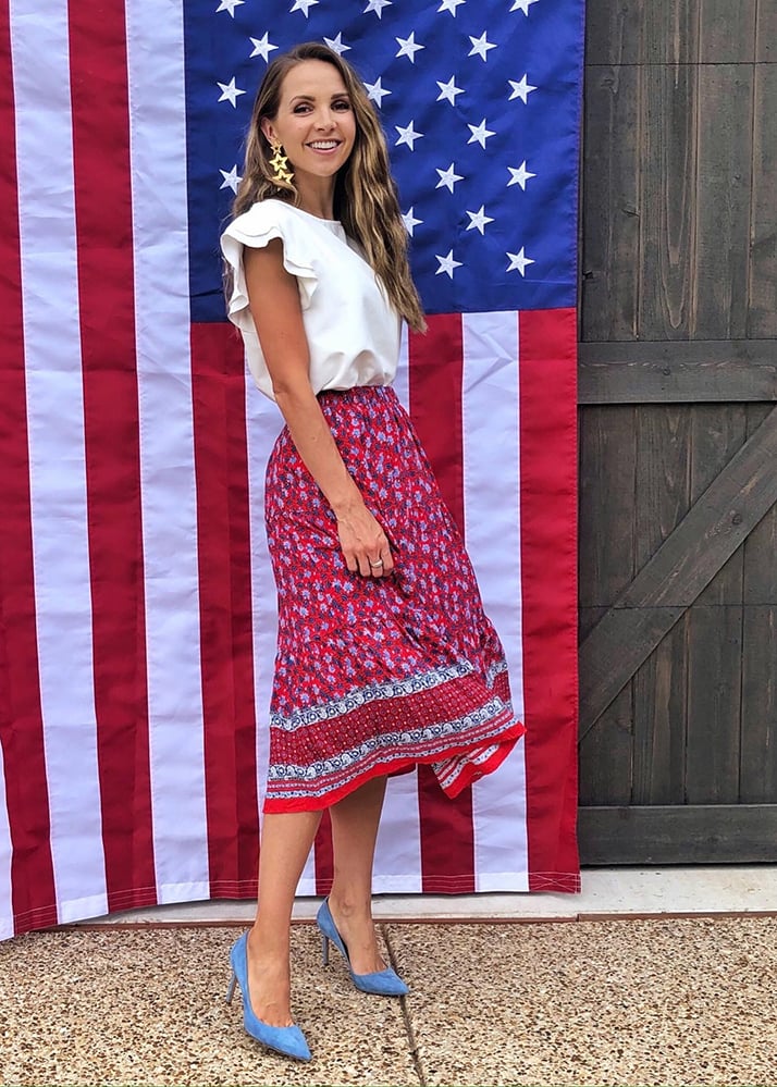 white top and floral mid skirt
