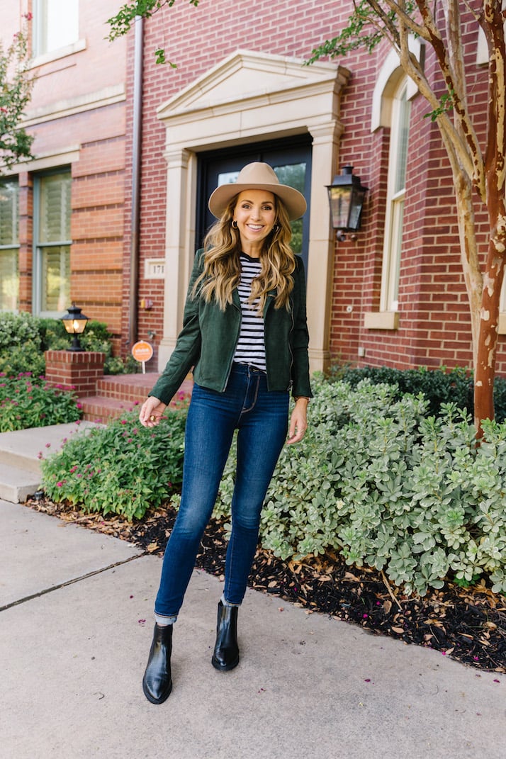 green suede jacket with striped t-shirt and felt fedora hat