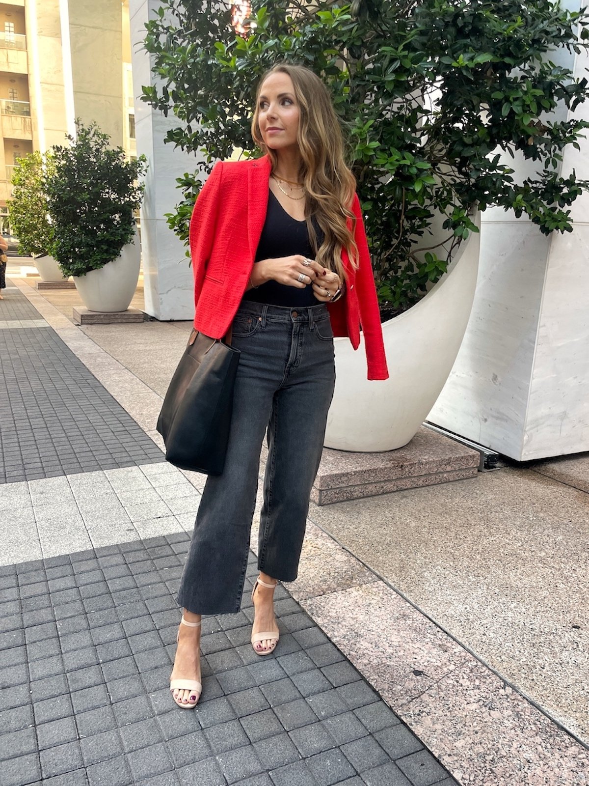 red-jacket with black bodysuit and gray jeans