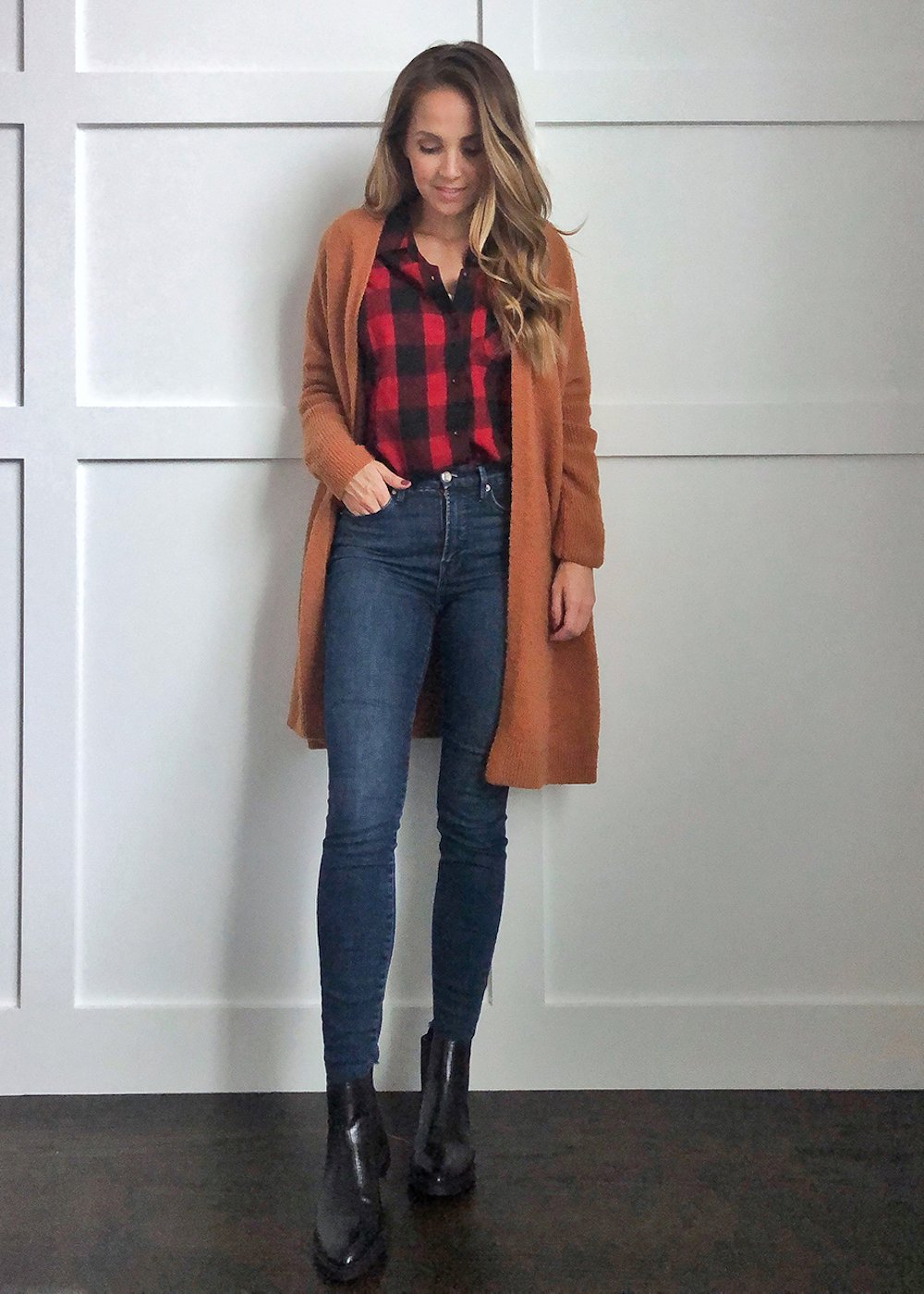 plaid shirt under a rust cardigan