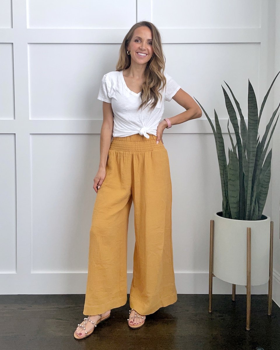 yellow pants and white knotted tee