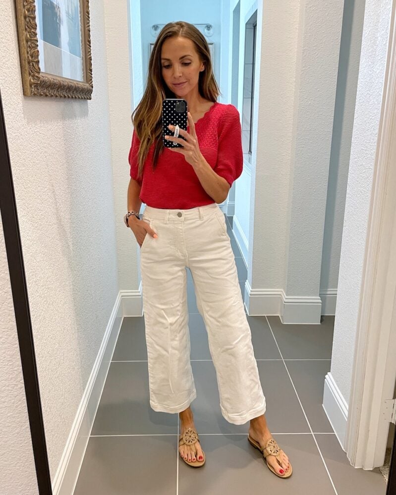 white pants and red sweater