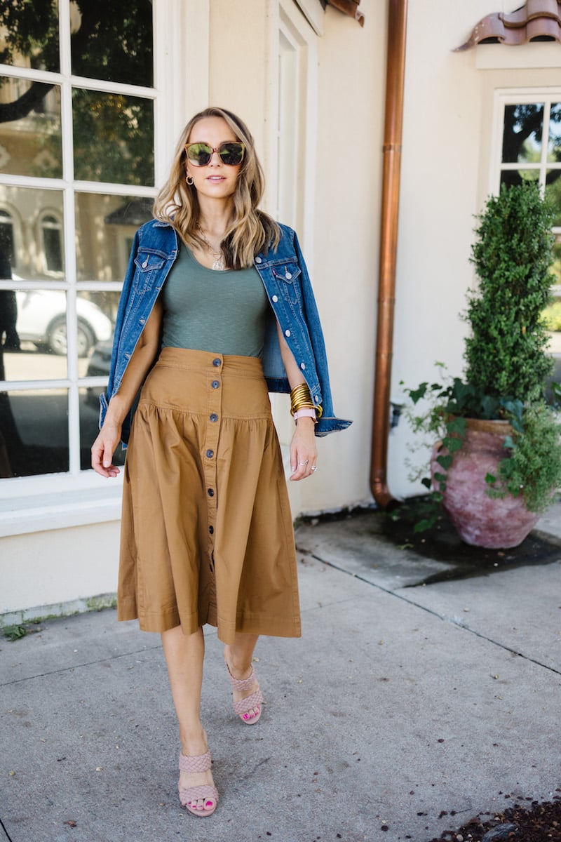 green bodysuit with brown skirt