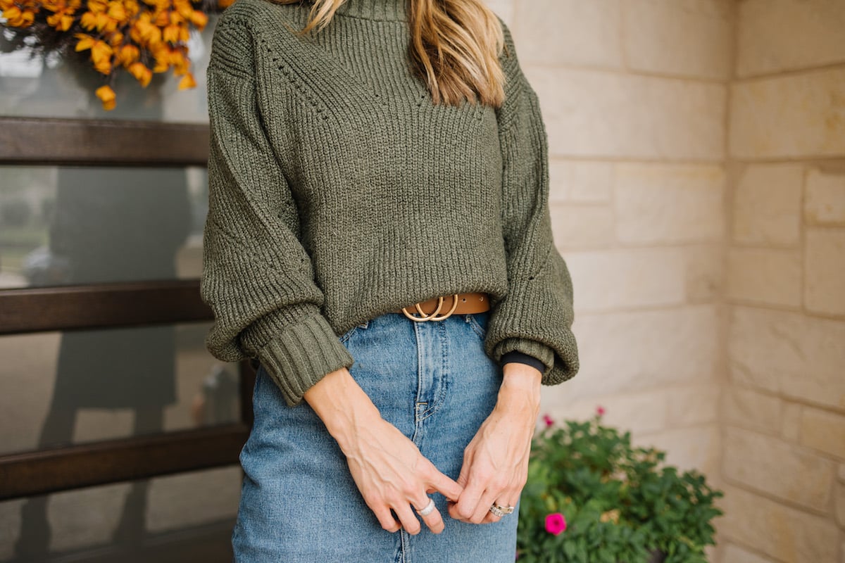 green sweater and denim skirt
