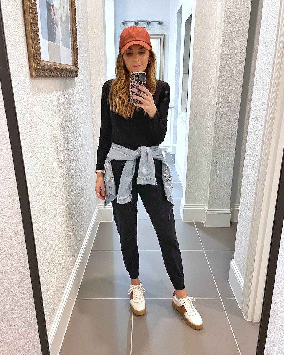 joggers and baseball hat