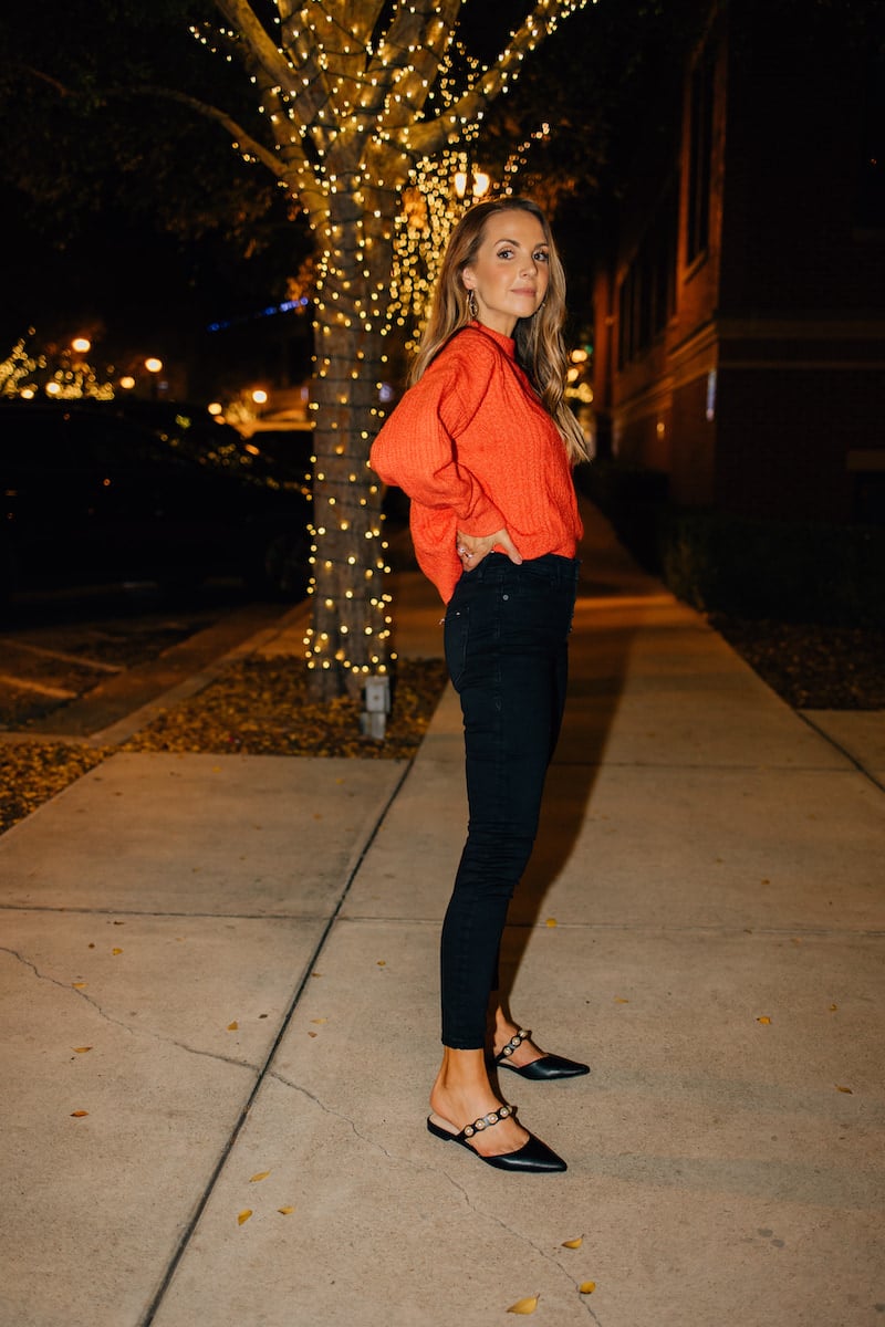 RED SWEATER WITH BLACK JEANS
