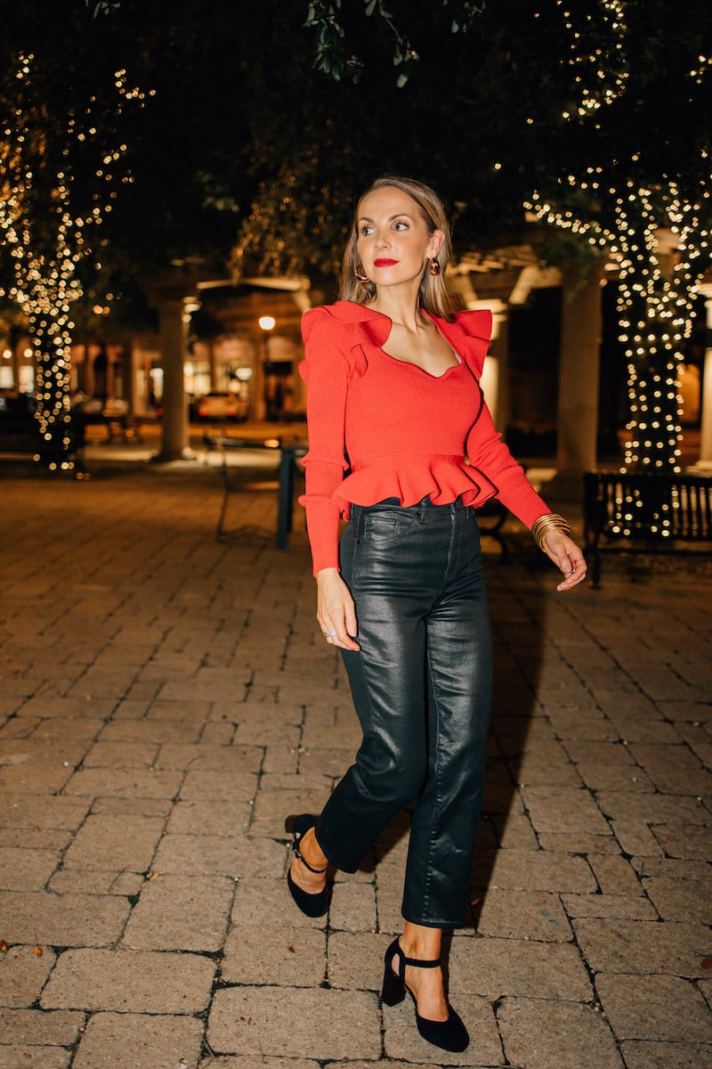 coated jeans and red ruffle top