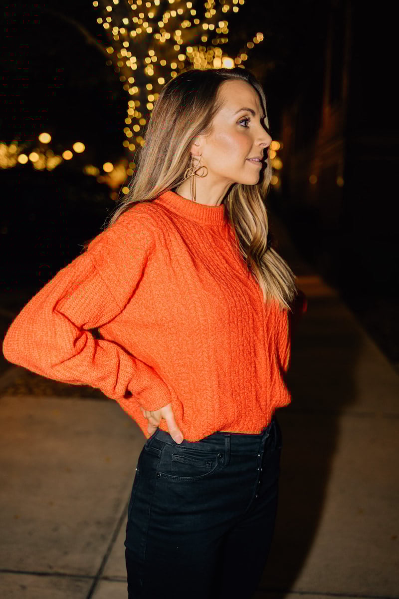 RED SWEATER WITH BLACK JEANS