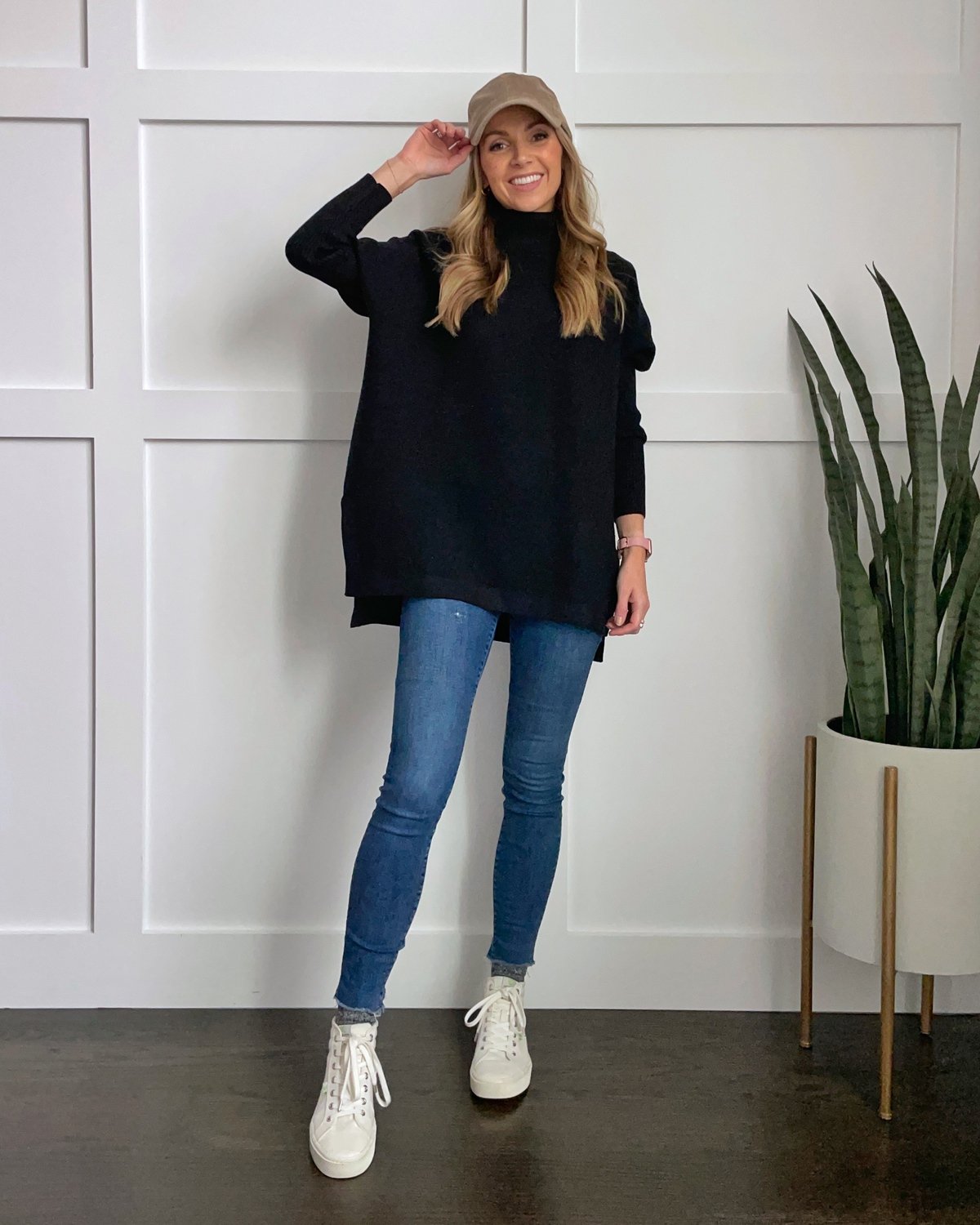 black tunic sweater with ball cap