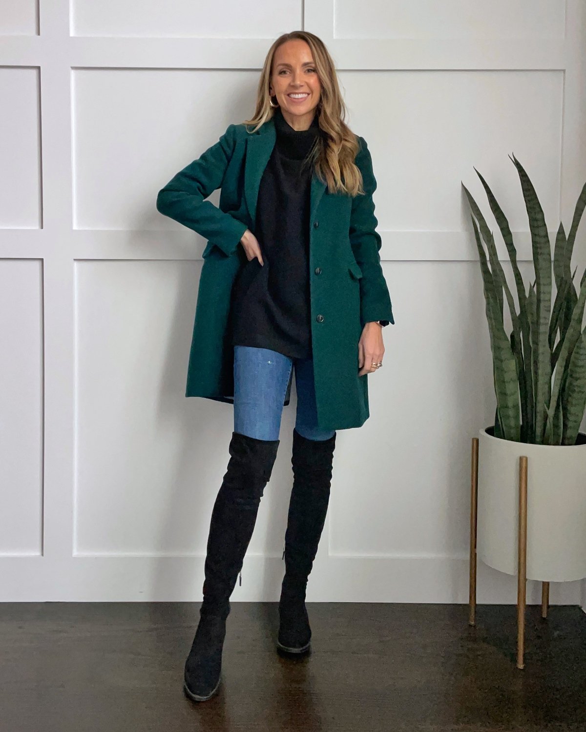 black tunic sweater with knee high boots
