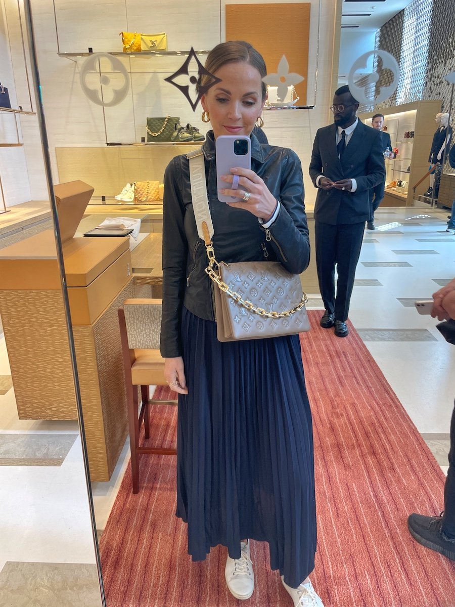 navy pleated skirt leather jacket