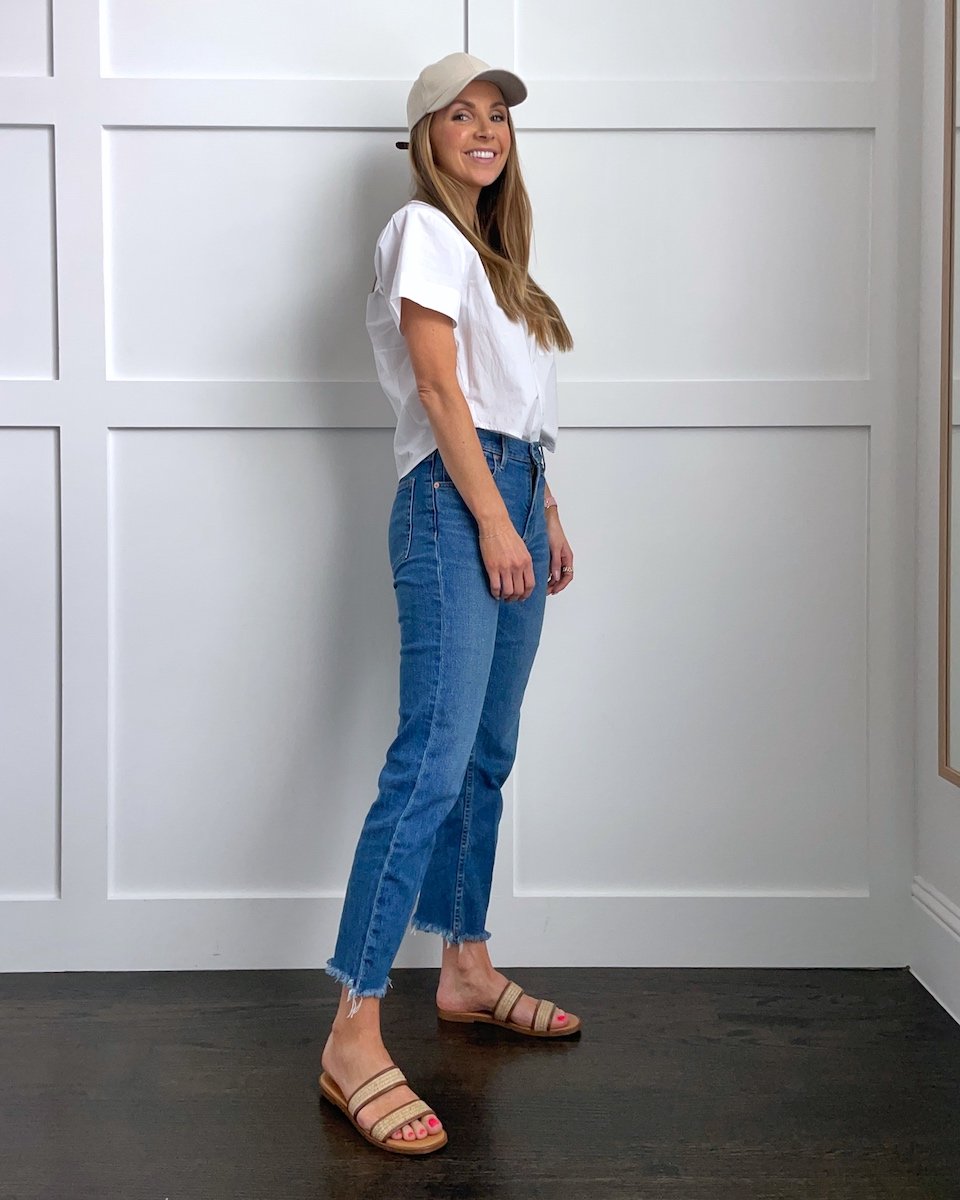 white shirt and jeans with baseball hat