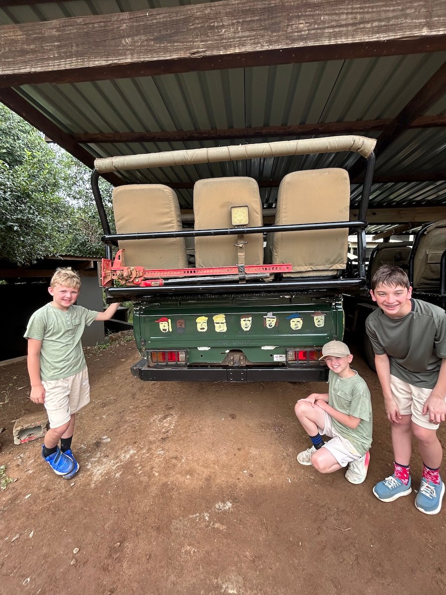 boys painting vehicle safari