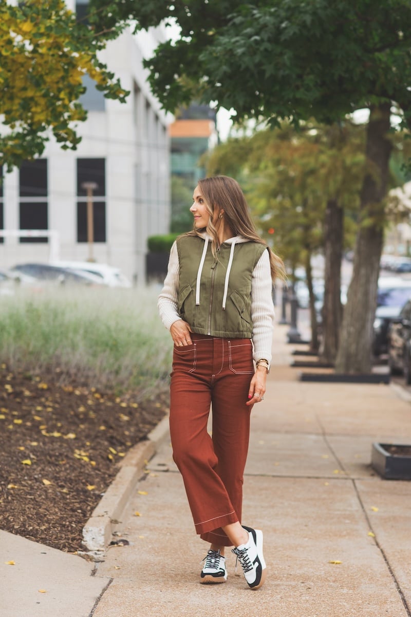 rust pants with hoodie and sneakers