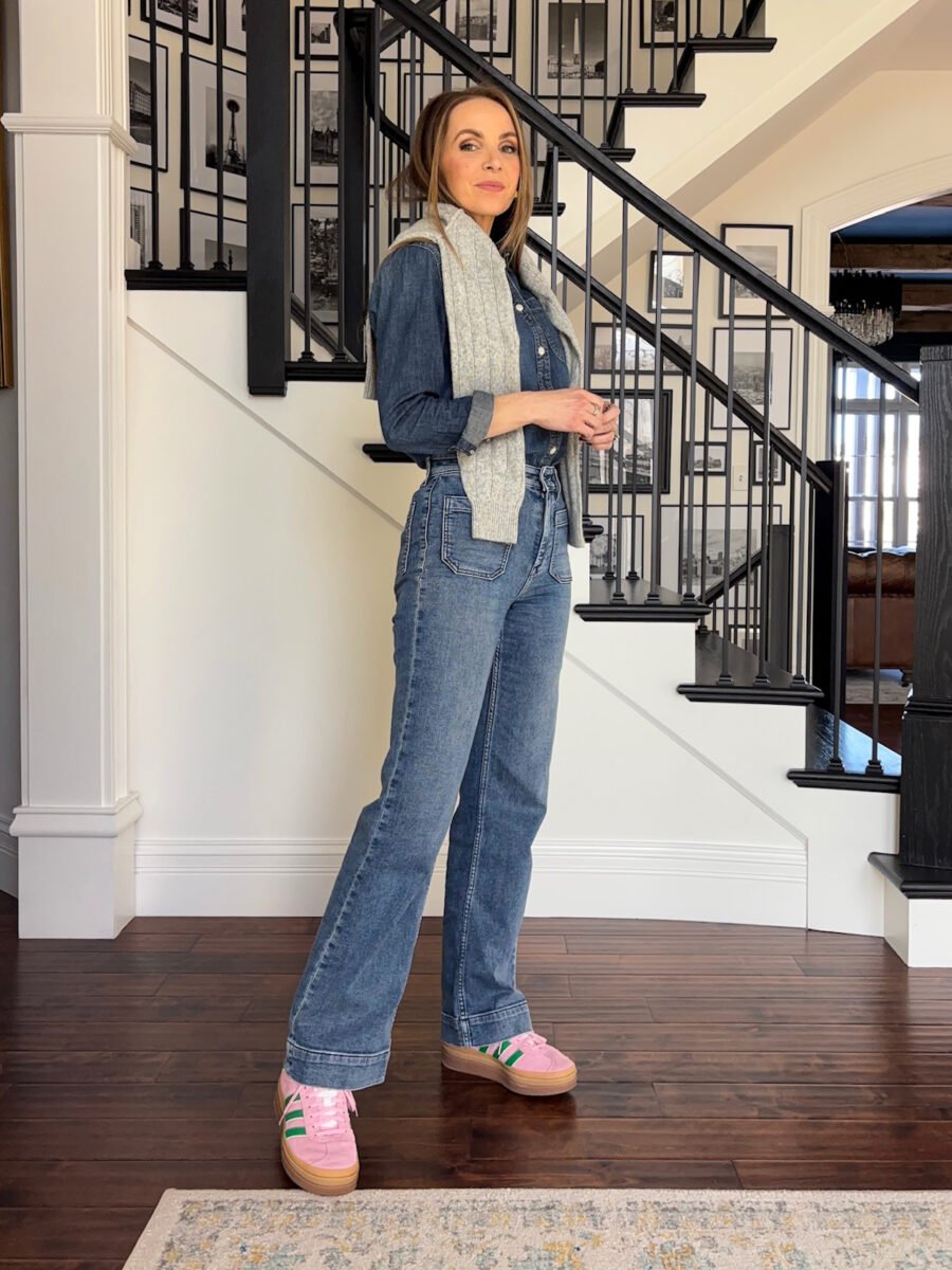 what to wear with colorful sneakers - Madewell denim shirt, faherty patch pocket jeans, green and pink gazelle adidas sneakers, grey sweater