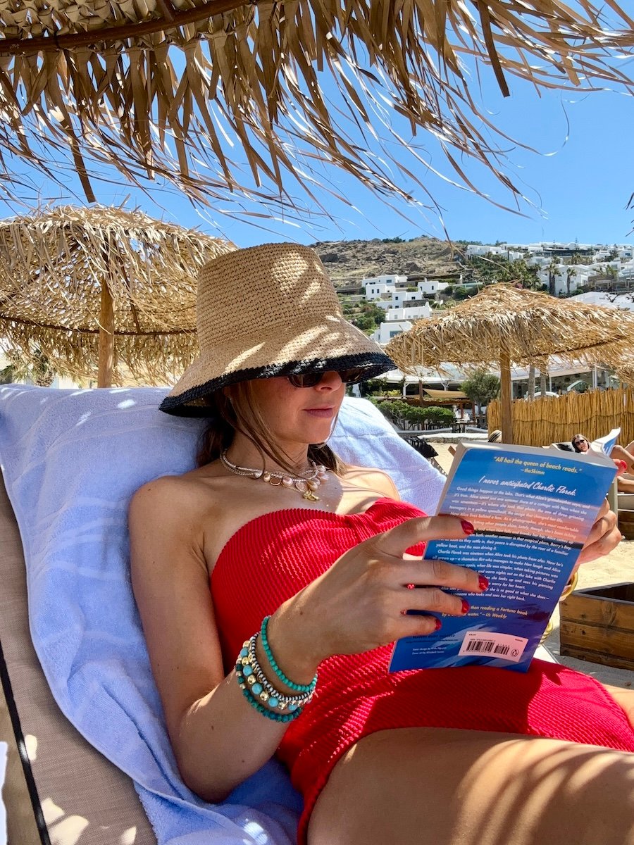 reading at the beach in Mykonos